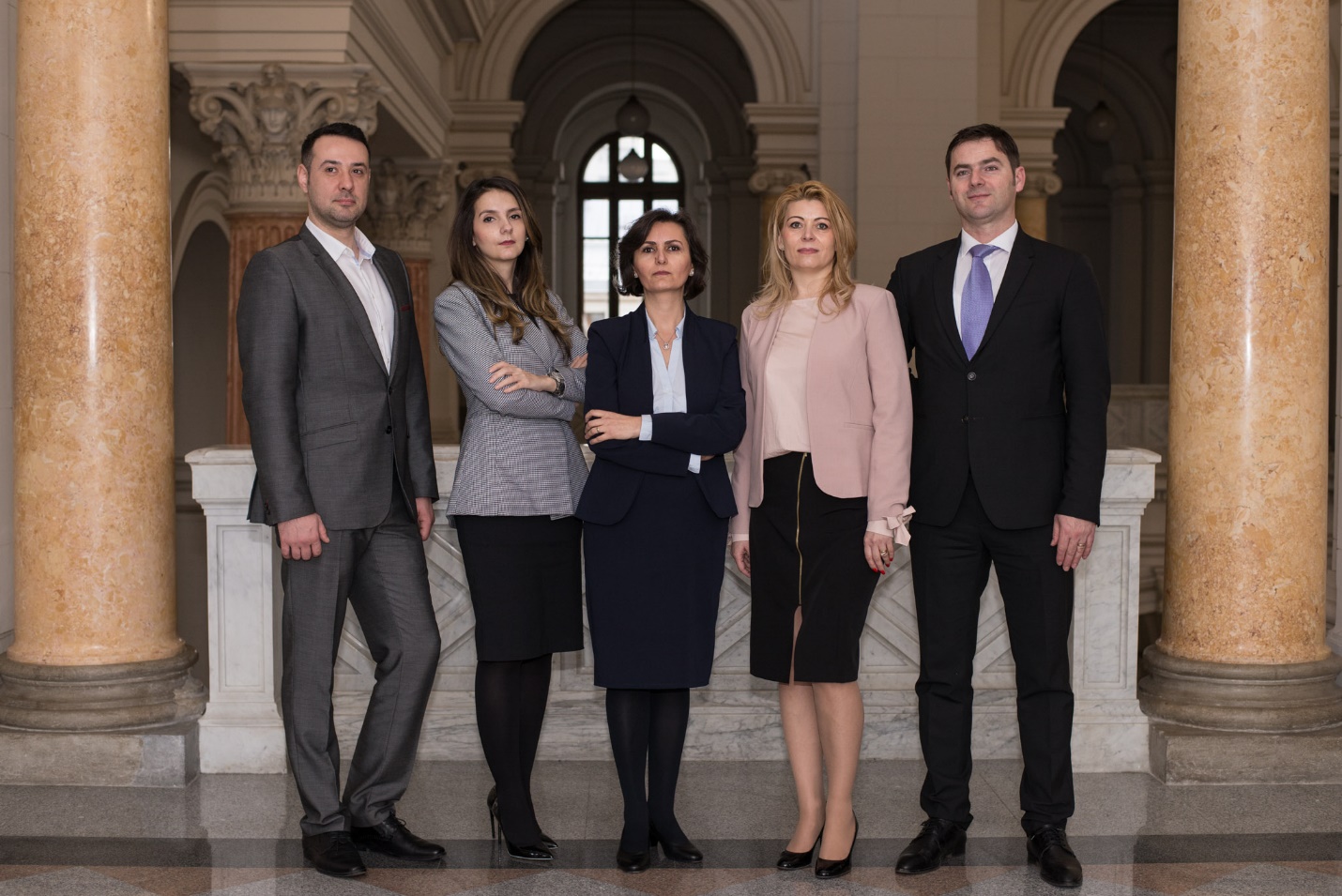 A group of people from Pop & Asociatii standing in front of a building

Description automatically generated